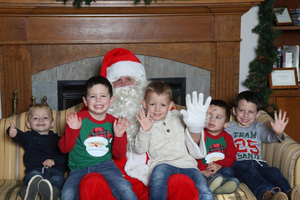 santa with 5 boys waving